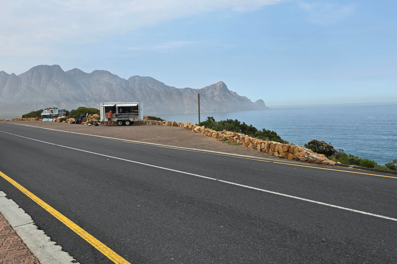 Scenic view of Clarence Drive winding along the rugged coastline between Gordon’s Bay and Betty’s Bay in the Western Cape, South Africa.