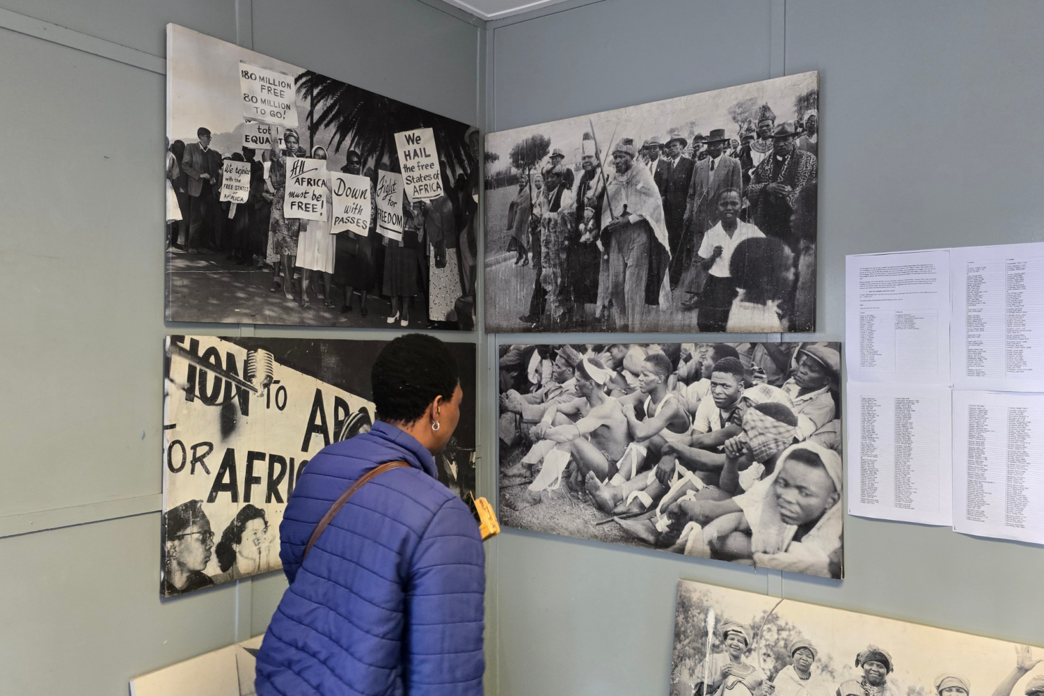 Local tour guide leading visitors on a walking tour through Langa Township in Cape Town, sharing the community's history, culture and daily life.